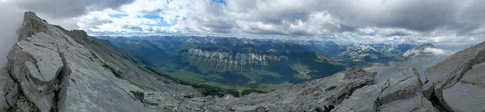 Panoramic view of a mountain range and clouds at the top of Mount Rundle Stock Photos
