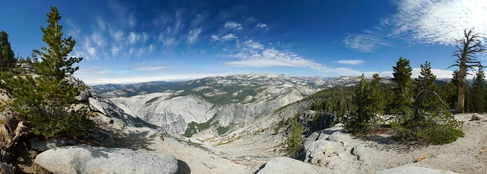 A panoramic view of a mountain range with a clear blue sky Stock Photos