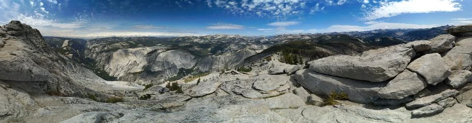A panoramic view of a mountain range with a clear blue sky Stock Photos