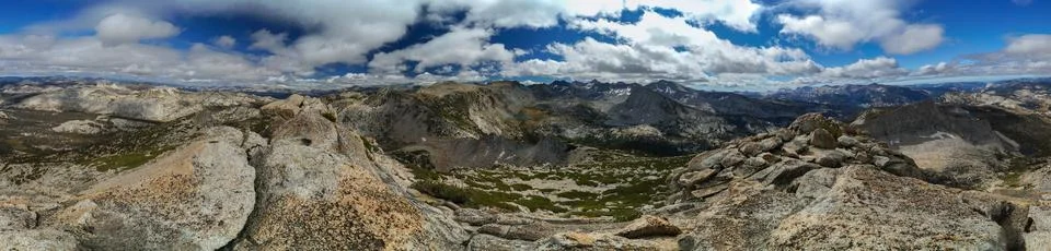 A panoramic view of a mountain range with a clear blue sky Stock Photos