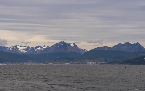 Panoramic view of a mountain range with snow from the Beagle channel, Ushuaia Stock Photos