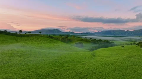 A panoramic view of a mountain range under a cloudy morning sky.  Stock Footage 320561385