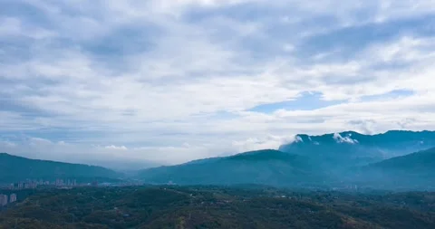 Panoramic view of a mountain range under a cloudy sky in medellin, colombia Stock Footage 341908459