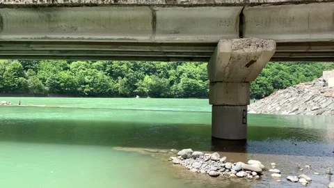 Panoramic view of the mountain river under the bridge Stock Footage 150664504