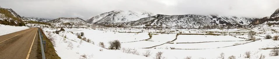 Panoramic view of mountain scenery with snow in winter, and road 스톡 사진