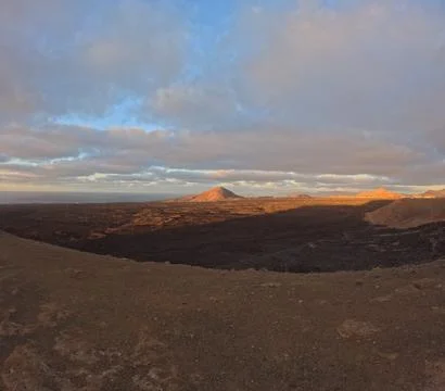 Panoramic view from a mountain top overlooking the volcanic coastline of Stock Photos