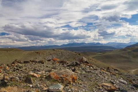 Panoramic view of a mountain valley summer, soft light, white clouds, blue sk Stock-Fotos