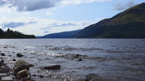 A panoramic view of mountains and a lake in Scotland. Stock Footage 112683746