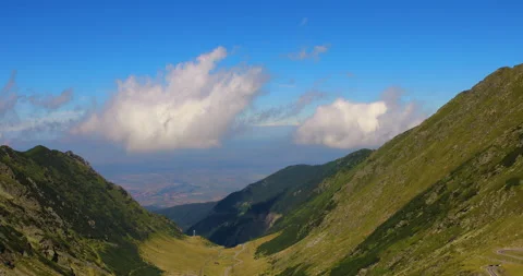Panoramic view mountains and white clouds on blue sky Stock Footage 138949112