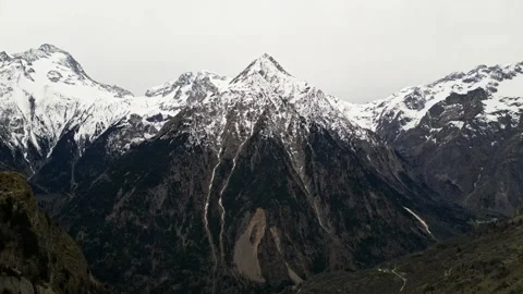 Panoramic view of the mountains from Les Deux Alps ski resort in the French Alps Stock Footage 244409168