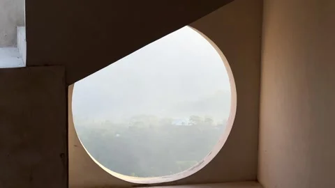 Panoramic view of mountains seen through a circular window Stock Footage 278445474