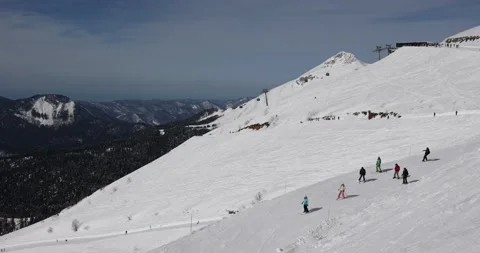 Panoramic view of the mountains of the ski resort. Snow, winter, winter sports,  Video stock 177365608