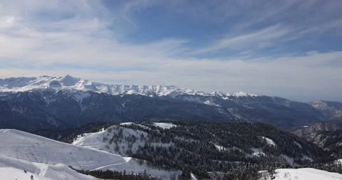 Panoramic view of the mountains of the ski resort. Snow, winter, winter sports,  Video stock 177366003