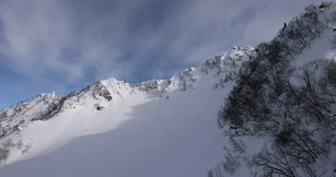 Panoramic view of the mountains of the ski resort. Snow, winter, winter sports,  Video stock 177367045