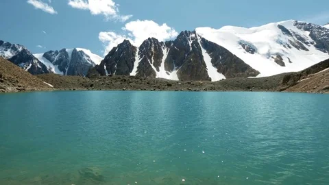 Panoramic view of the mountains with the snow and the bright sun and cloud Stock Footage 73349636