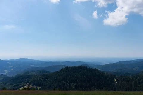 Panoramic view of the mountains under the blue cloudy sky in summer Stock Photos
