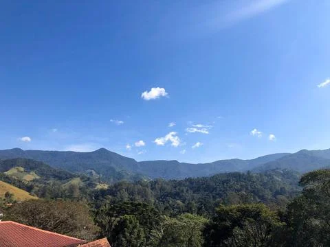 Panoramic view of mountains under blue sky Фото