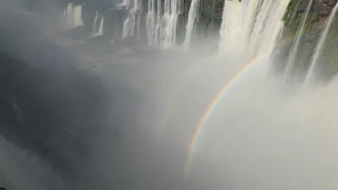 Panoramic view of multiple waterfalls through thick mist and water spray, with Stock Footage 328892029