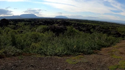 Panoramic view of Myvatn lava fields and distant mountains, Iceland Vídeos de archivo 333450623