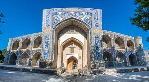 Panoramic view of Nadir Devan Begi Madrasah, an architectural monument in B.. Stock Photos