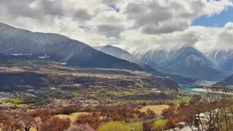 Panoramic View of Namcha Barwa Peak Mountains and Blooming Valley in Tibet China Stock Footage 338311111