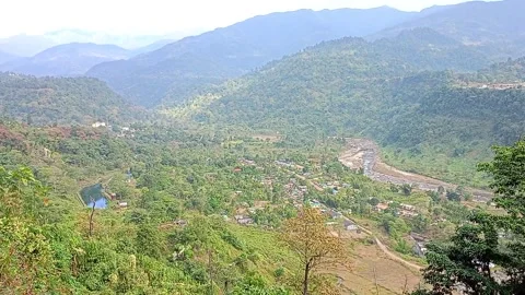 Panoramic view of Nepal's mountains surrounded by a vibrant forest Stock Footage 278052152