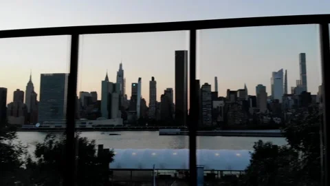 Panoramic View of New York City Skyline Through Outdoor Lounge Glass Stock Footage 142315946