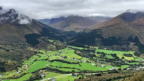 Panoramic view of norwegian village below mountain Stock Footage 337365035