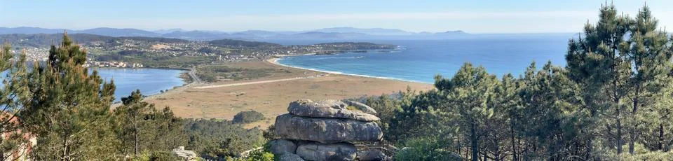 Panoramic view from the observation deck of the beautiful Lanzada beach, O .. Stock Photos