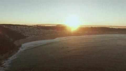 Panoramic view of ocean next to city with houses and buildings during sunset Video stock 160809381