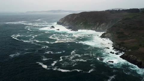 Panoramic View Of Ocean Waves Hitting Rocky Cliffs Near Coastal Park Stock Footage 236643230