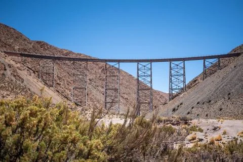 Panoramic view of an old and rusty railroad bridge. Stock Photos