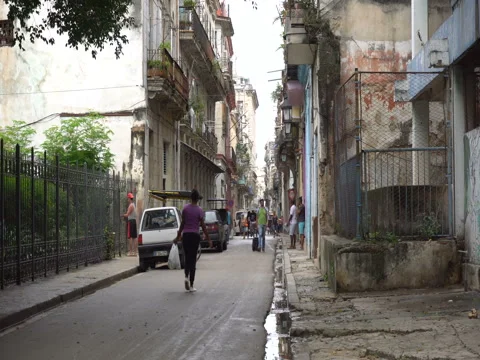Panoramic view to old colonial buildings of Havana. Latino man in colorful Stock Footage 70852910