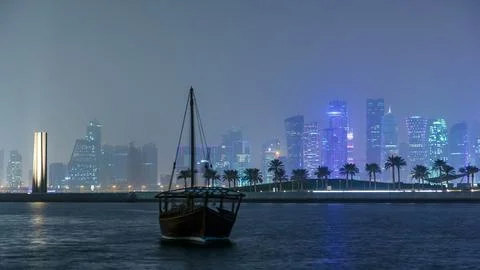 A panoramic view of the old dhow harbour night timelapse in Doha, Qatar, with Fotos de archivo
