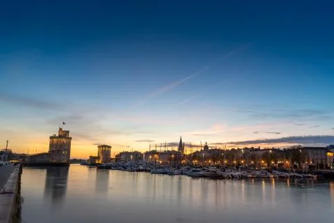 Panoramic view of the old harbor of La Rochelle at blue hour Stock Photos