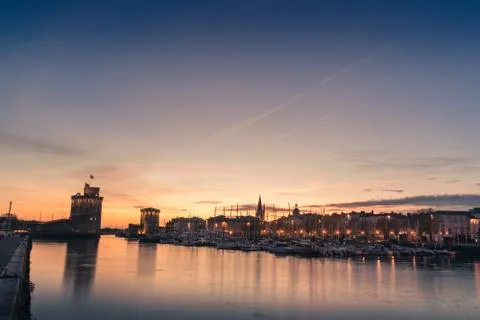 Panoramic view of the old harbor of La Rochelle at blue hour Stock Photos