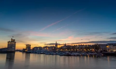 Panoramic view of the old harbor of La Rochelle at blue hour Stock Photos