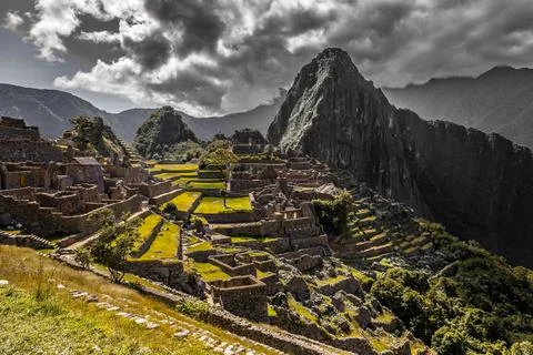 Panoramic view to old Inca ruins and Wayna Picchu with grey clou Stock Photos