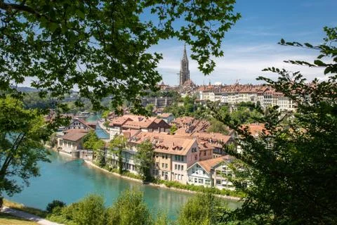 Panoramic view of the Old Town of Bern between maple tree in Switzerland. Stock Photos