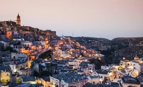 Panoramic view of old town at sunset Sassi di Matera Basilicata, Italy. Stock Photos