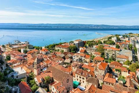 Panoramic view of Omis town between hills and Cetina River Stock Photos