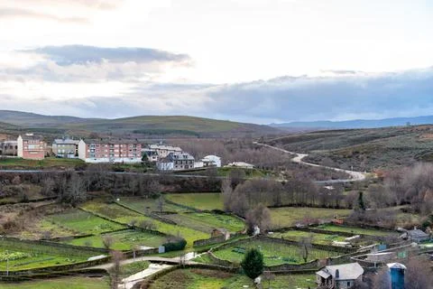 Panoramic view of the orchards and modern buildings together with roads and h Stock Photos