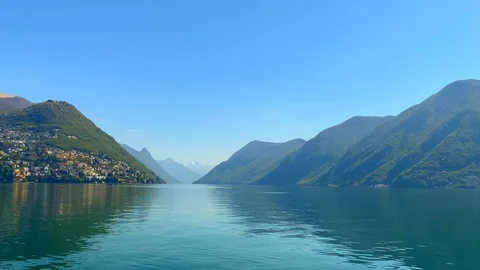 Panoramic View over Alpine Lake and Mountain 動画素材 128570478