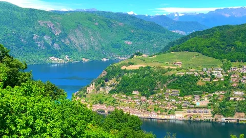Panoramic View over Alpine Lake and Village Morcote and Mountain in a Sunny Day Stock Footage 129663209