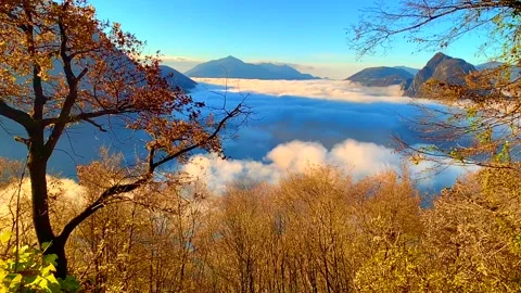 Panoramic View over Alpine Lake Lugano with Sea of Clouds and Mountain 動画素材 194011656