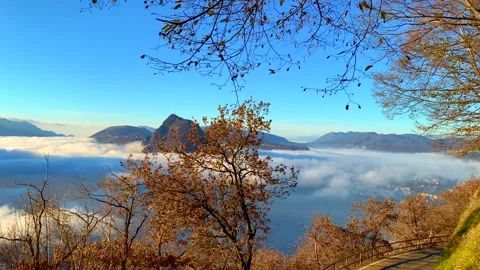 Panoramic View over Alpine Lake Lugano with Sea of Clouds and Mountain 動画素材 194011662