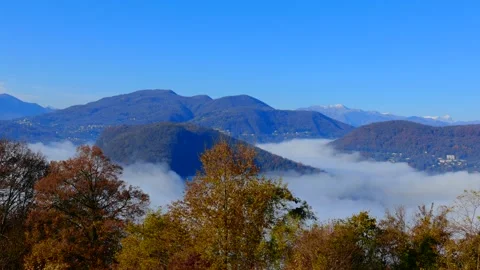 Panoramic View over Alpine Lake on the Border to Italy with Sea of Clouds Stock Footage 194011664