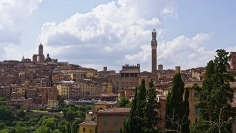 Panoramic View Over Hilltop Cityscape with Tower and Clouds Stock Footage 255678089