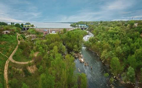 Panoramic view over a landscape of river, lake and forest 写真素材