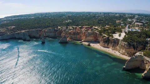 Panoramic view over the sea cliff at Ponta Da Piedade in Algarve, Portugal 4K Stock Footage 162956240